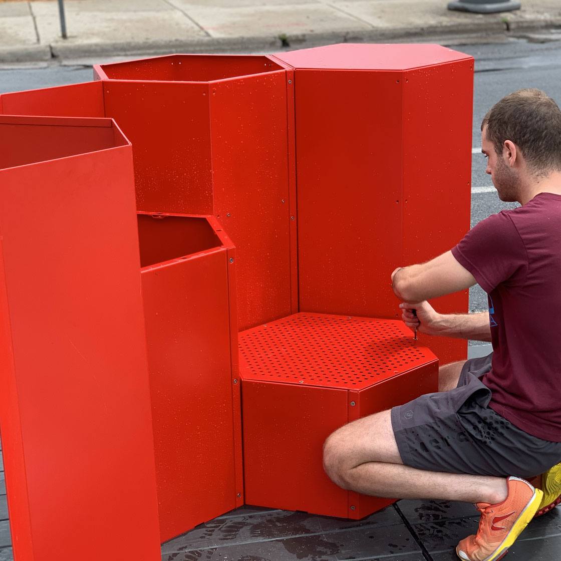 Someone constructing a modular seating-scape