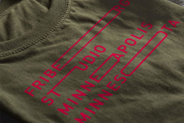 Closeup of screen printed t shirts with ken friburg logo