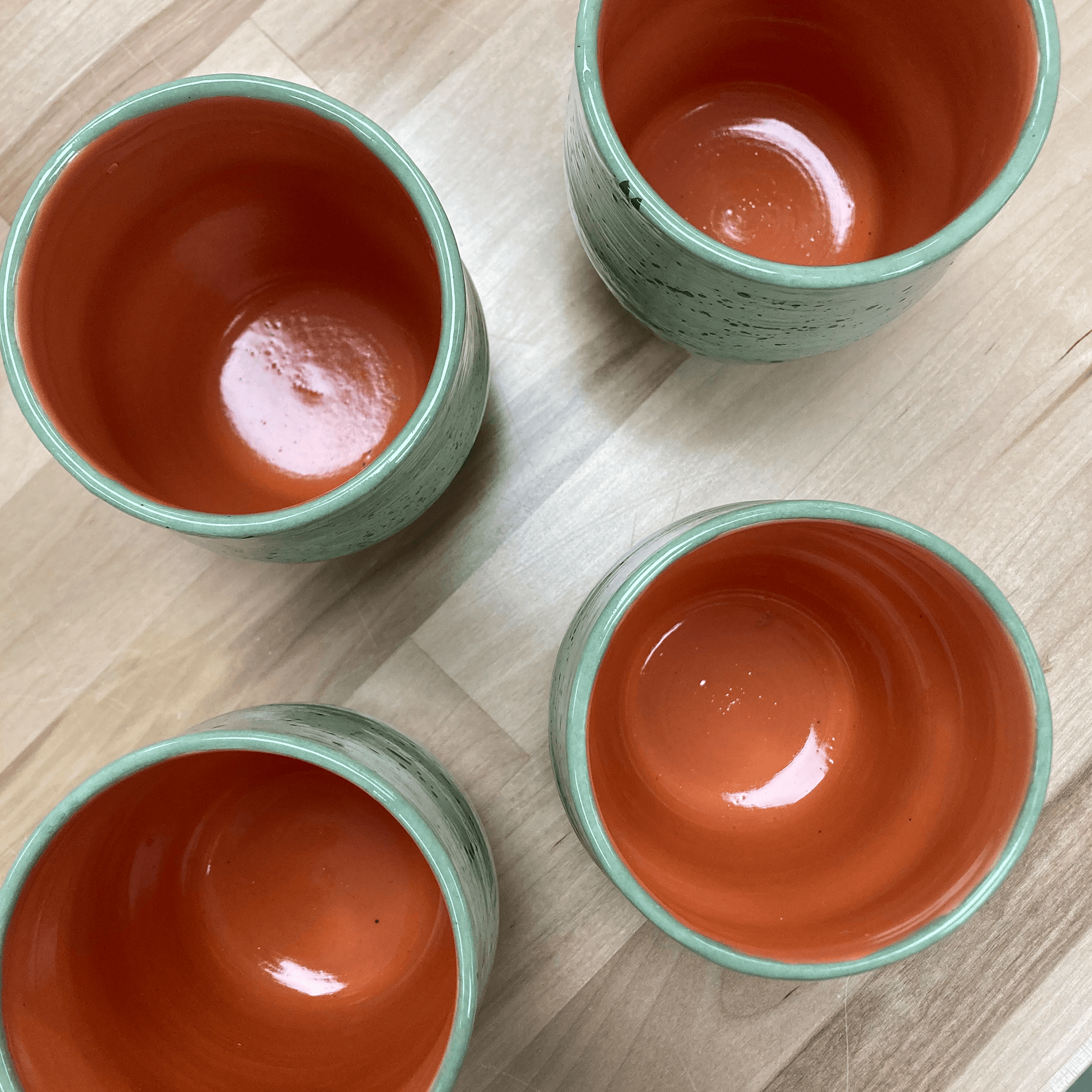 4 ceramic cups on a table