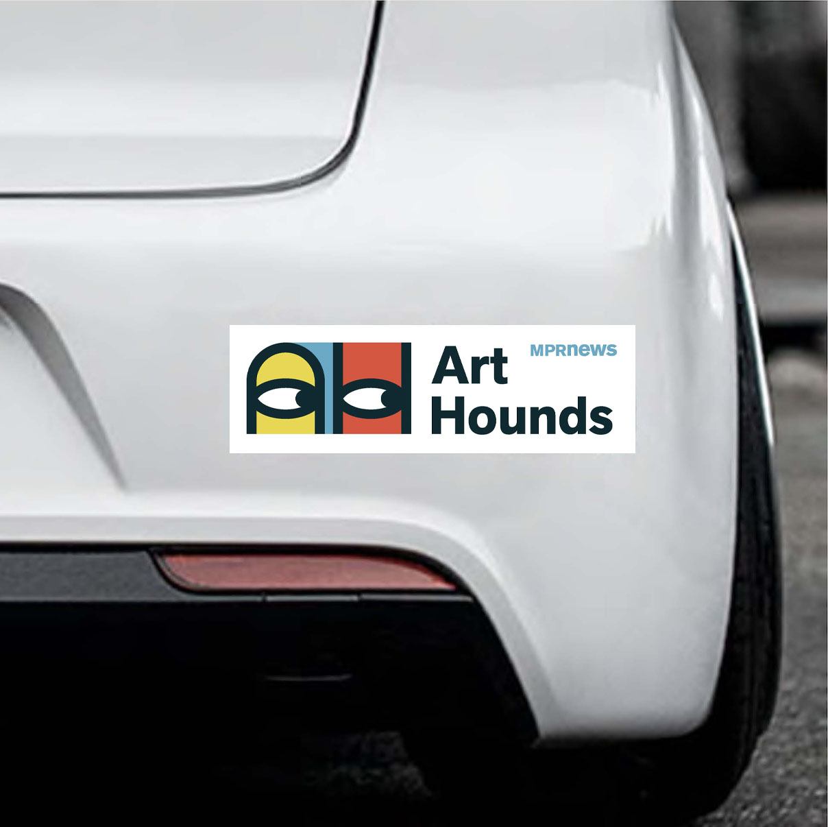 A colorful bumper sticker with the logo for Art Hounds